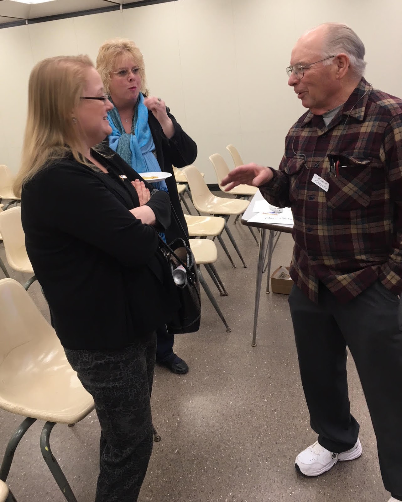 Assemblywoman Addie A.E. Jenne (foreground) and Watertown City Council member Lisa Ruggerio visit with C. Bruce Kingsley, chair of the Jefferson-Lewis Counties chapter of SCOPE