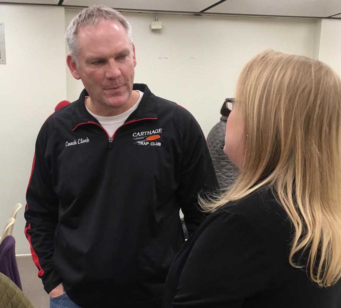 Assemblywoman Addie A.E. Jenne visits with Brian Clark, coach of Carthage's clay target team. Mr. Clark, who describes himself as an avid shooting sports participant, led the effort to get approval for the team to participate in the the New York Stat