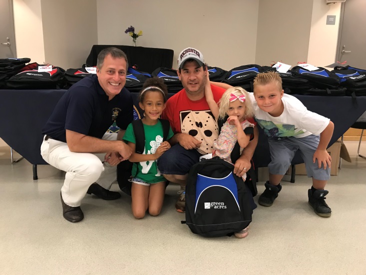 Assemblyman Brian Curran partnered with Green Acres Mall to give away 100 backpacks and school supplies to Freeport families.