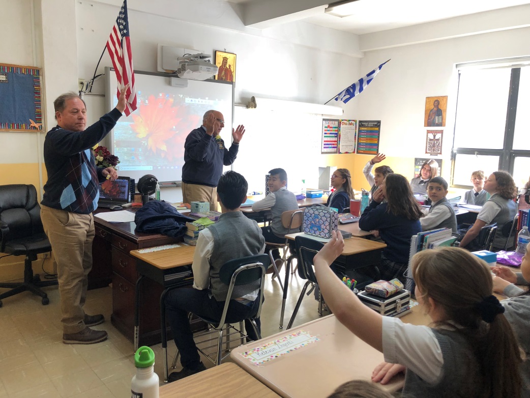 Assemblyman Steve Hawley and Assemblyman Michael Benedetto speak to students at the Greek-American Institute of New York in the Bronx
