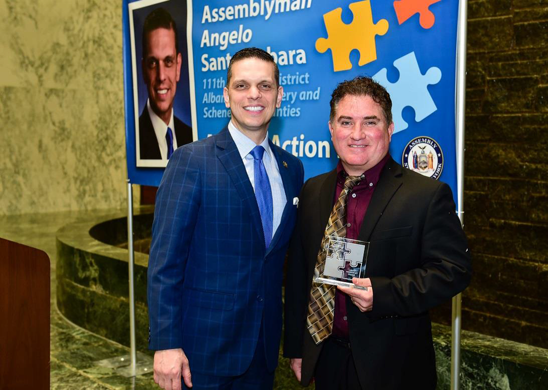 Assemblyman Santabarbara presents Brian Spagnola, President and General Manager of the Amsterdam Mohawks, with the 2019 New York State Autism Action Award, an annual award recognizing individuals and organizations that go above and beyond to support the g