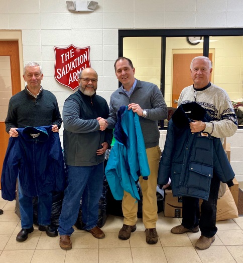Pictured above: Assemblyman Mike Norris (second from right) drops off winter clothing items that were collected from the community as part of his annual drive. Standing with the assemblyman are Salvation Army Major Jose Santiago (second from left) and Sal