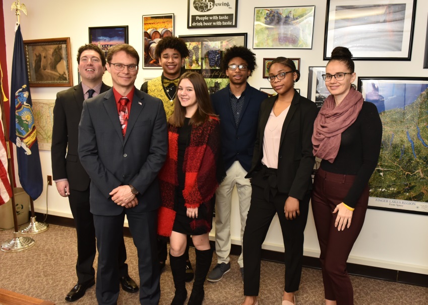 (Left to right)  Counselor Nick Matyas, Assemblyman Christopher Friend (R,C,I-Big Flats), Xymier Thomas, Madison Oliveri, Kaelin Thomas, Ruby Moncrieft and Counselor Autumn Loke meet to discuss the Binghamton University Liberty Partnership Program, an org