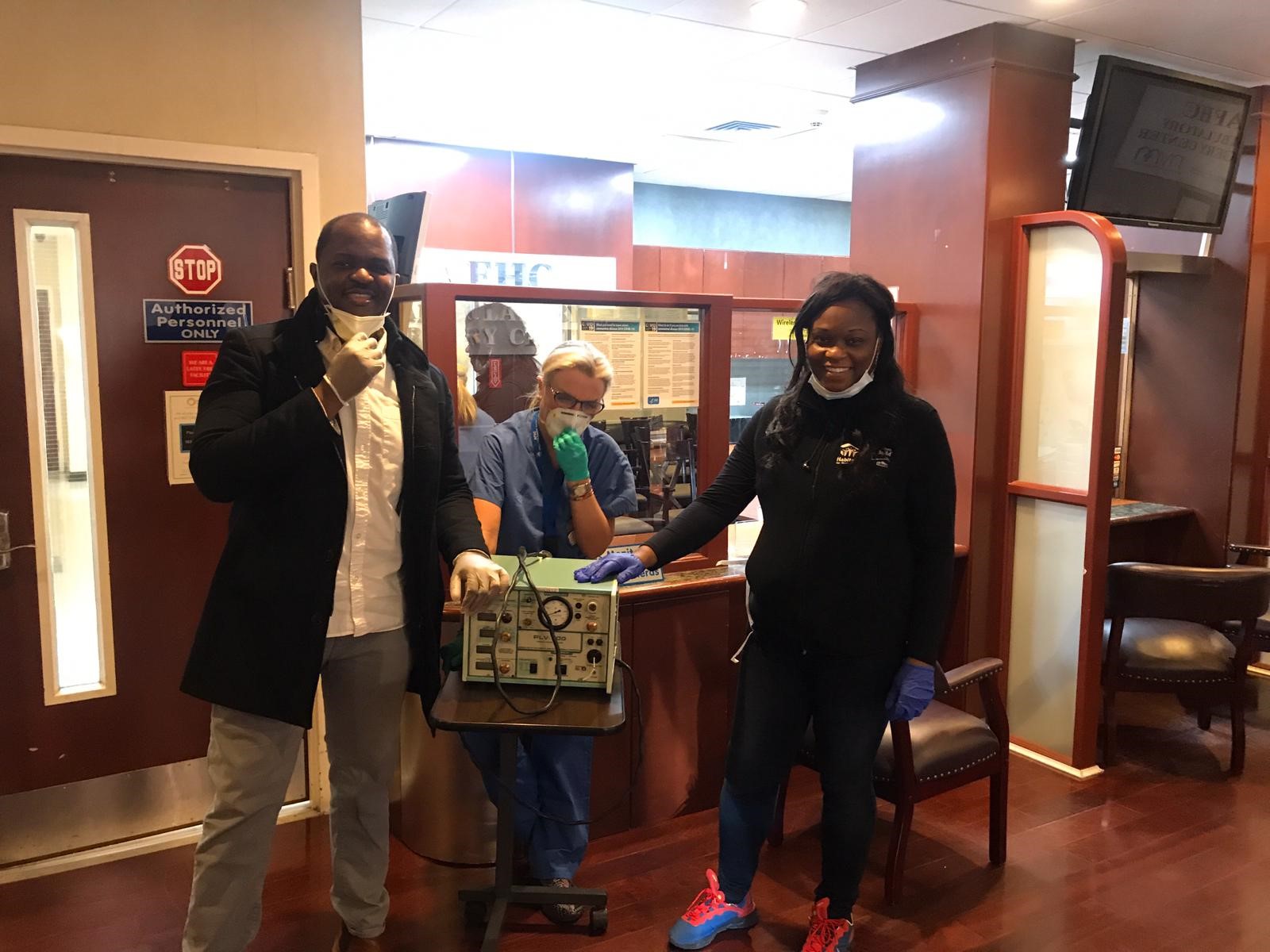 Assemblymember Rodneyse Bichotte and District Leader Josue Pierre delivering a ventilation device to a local clinic on March 27, 2020.