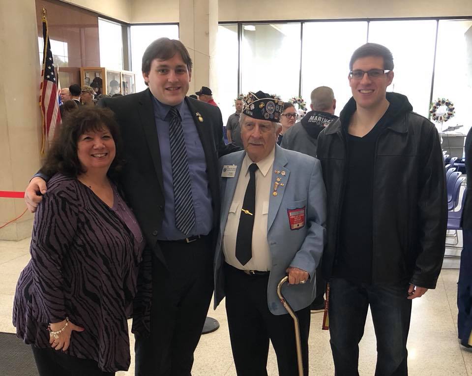 Assemblyman Doug Smith joins Salvatore Scarlato, President of the New York Chapter of the Korean War Veterans, and his family.
