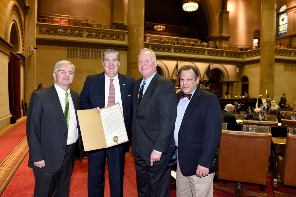 Assemblyman Fred Theile, Jr., Kevin McCrudden of Smithtown, Assemblyman Michael Fitzpatrick (R,C,I-Smithtown), and Assemblyman Andrew Raia (R,I,C-East Northport) take a photo to commemorate the Assemb