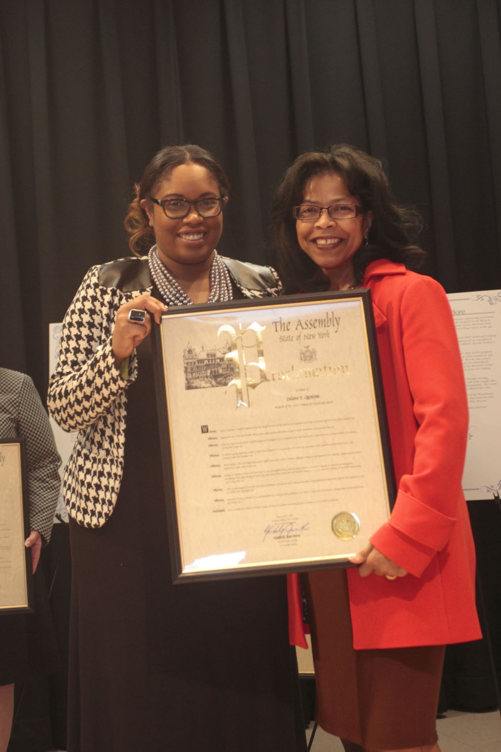 Assemblywoman Kimberly Jean and Madeline Quintyne, accepting the award on behalf of her mother, Dolores Quintyne, at the 2015 Women of Distinction Awards Ceremony