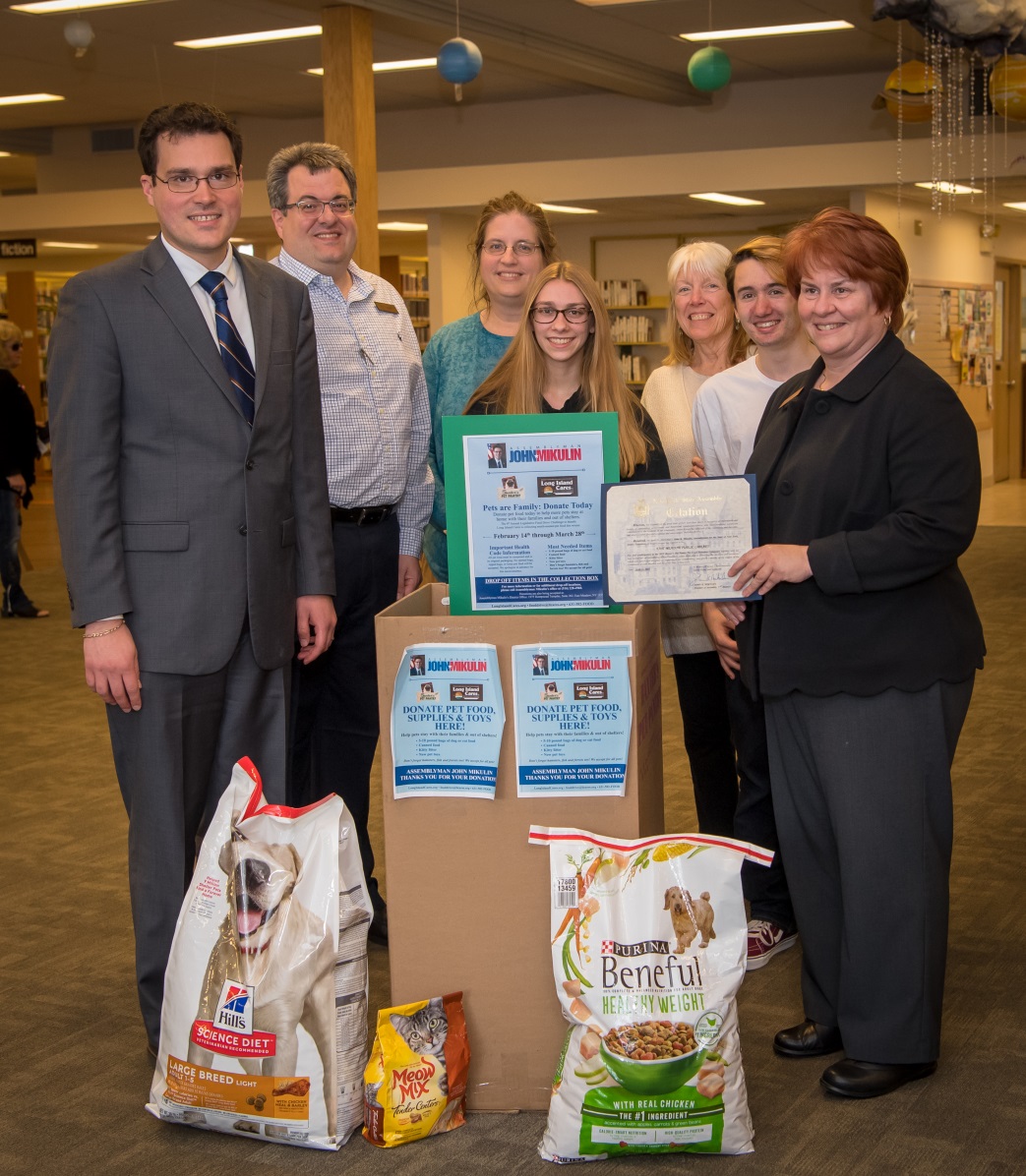 Assemblyman John Mikulin (R,C,Ref-Bethpage), library employees (from left to right) Rocco Cassano, Mary Loiacono, Julia Incammicia, Karen Brown, Rhyan Mogilski and Carol Probeyahn, the library directo