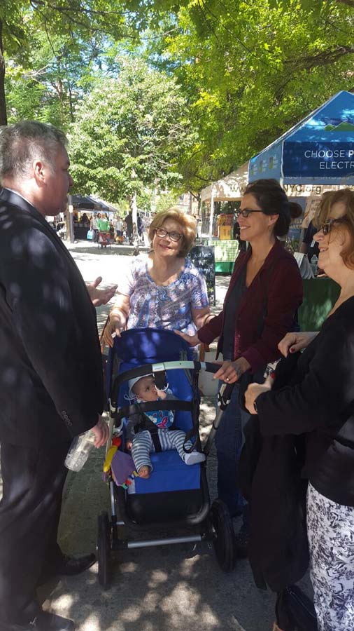 Assemblymember O'Donnell converses with constituents at a Farmers Market in the district.