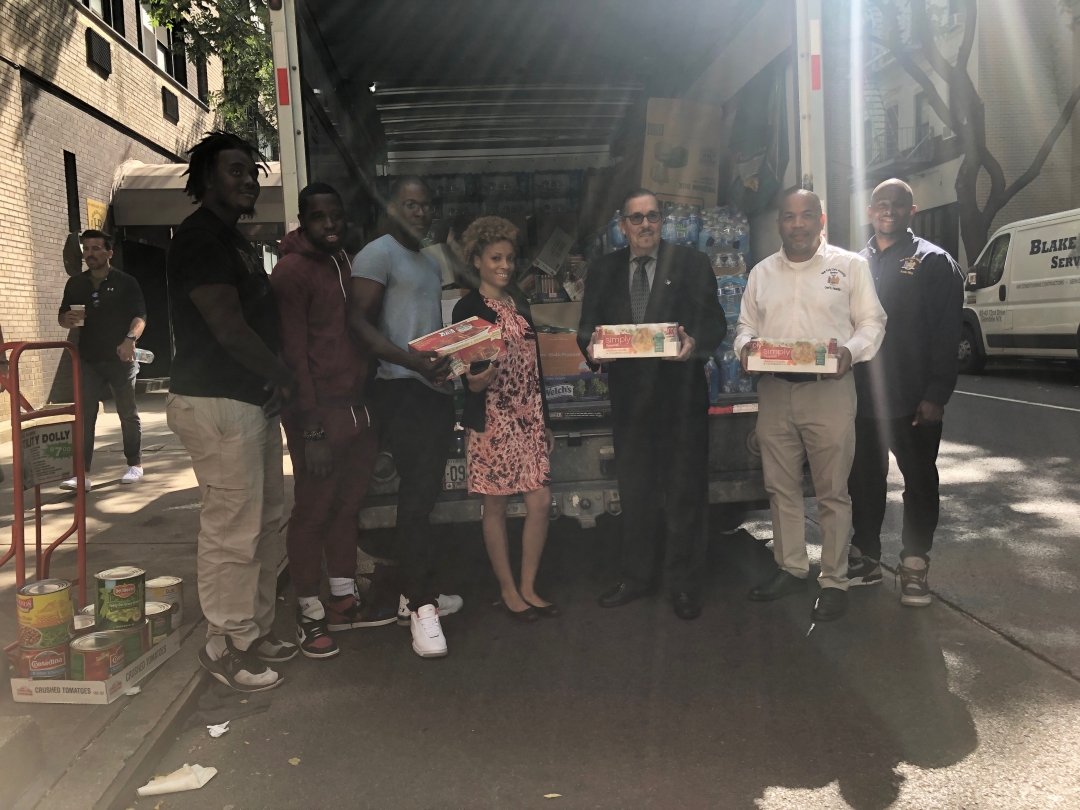 Speaker Heastie and Consul General Larry Cartwright put together food drive for people affected by the hurricane in the Bahamas.