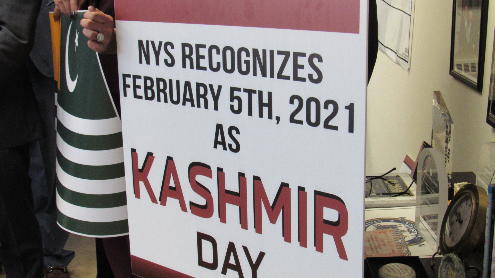 American Pakistani Advocacy Group members bring signs to Assemblyman Sayegh’s office in Yonkers.