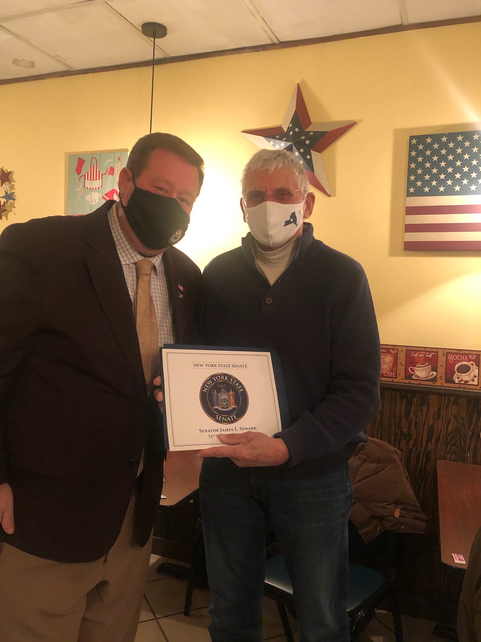 Assemblyman Chris Tague (R,C,I,Ref-Schoharie) presents Bruce Palmatier with an Assembly Citation as well as recognitions from the New York State Senate and United States House of Representatives on be