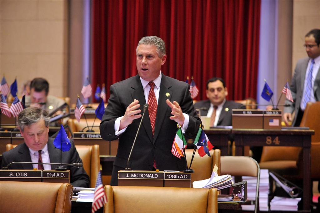 Assemblymember McDonald debating on the floor of the Assembly Chamber during legislative session.