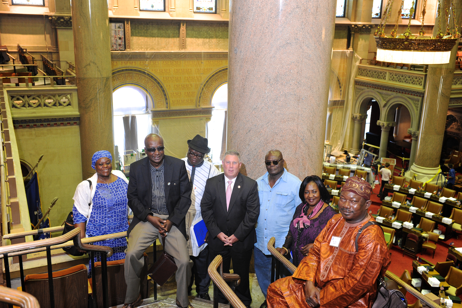 Assemblymember McDonald welcomes Nigerian delegates from the International Center of the Capital Region to the Assembly Chambers.
