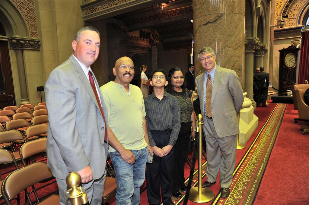 Assemblymember Phil Steck welcomes Ryan Devanandan, Scripps Capital Region Spelling Bee Champion and National Spelling Bee contestant, along with his parents, Anita and Moses Devanandan, and Sand Cree
