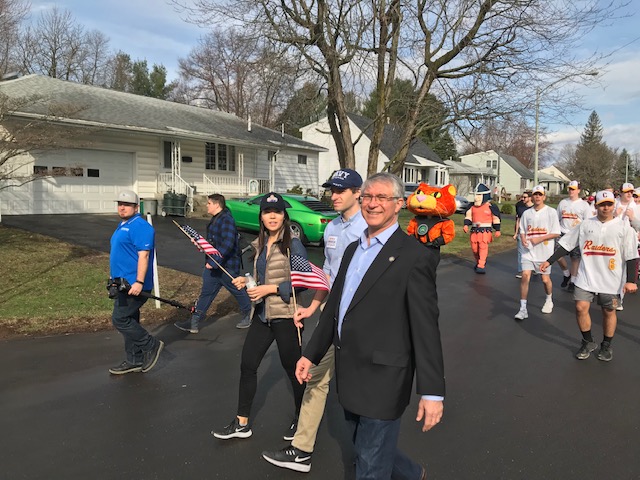 Assemblymember Phil Steck walks in the Colonie Little League Opening Day Parade