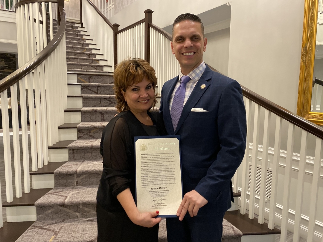 Assemblyman Angelo Santabarbara presents Ladan Alomar with a citation from the New York State Assembly at the annual Centro Civico Annual Awards Gala at the Glen Sanders Mansion on Saturday night, rec