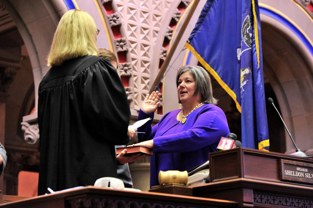 Assemblywoman Carrie Woerner is sworn into office by Judge Christine Clark