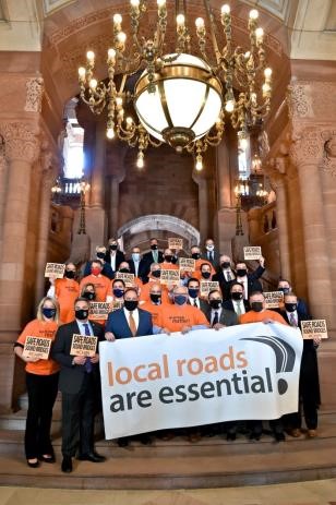 Assembly members and senators gather together for a press conference urging for full funding of critical programs to support upstate infrastructure on March 3, 2021.