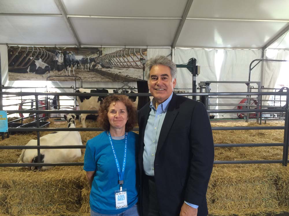 Assemblyman Stirpe visits the Calf Birthing Center at the State Fair with Melanie Palmer from the CCE Onondaga.
