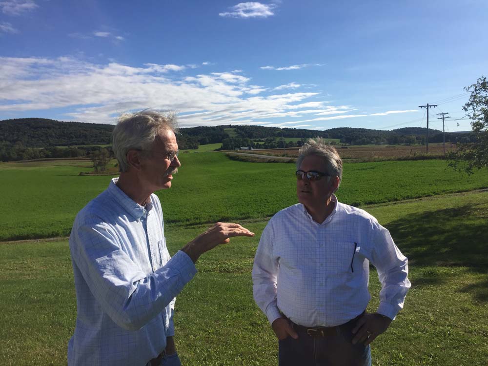 Michael Ward, of Field House Farms in Fabius, (left) and Assemblyman Stirpe discuss beef farming and local issues.