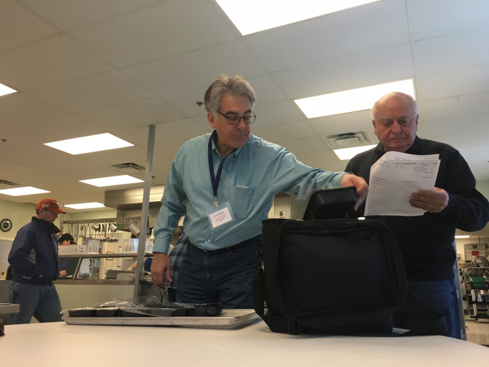 Assemblyman Al Stirpe works with volunteers to pack and deliver meals for the North Area Meals On Wheels program. Meals On Wheels is always looking for volunteers to help with their mission to feed ne