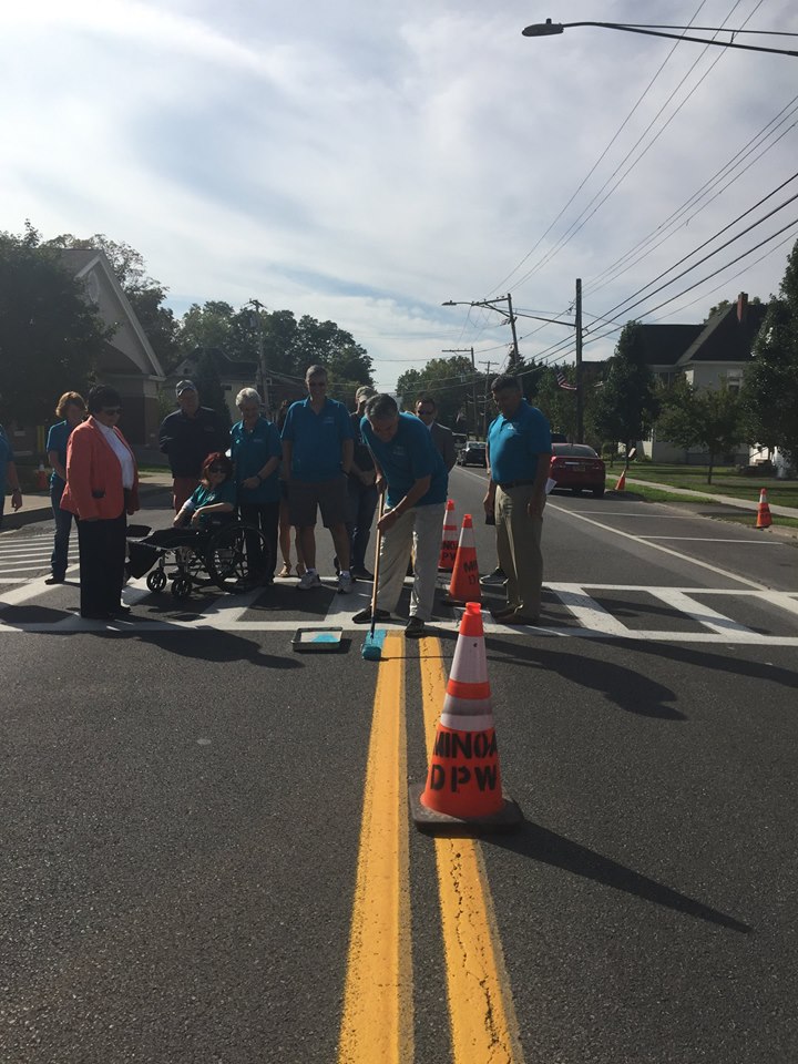 Assemblyman Al Stirpe helped raise awareness about ovarian cancer by assisting Hope for Heather in their efforts to paint the village teal in Minoa