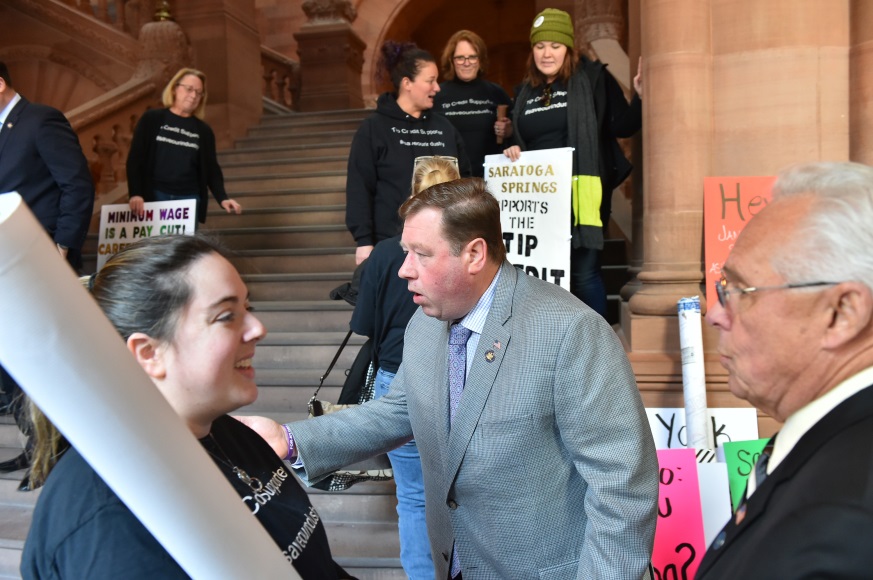 Pictured: Assemblyman Chris Tague (R,C,I,Ref-Schoharie) speaking with concerned tip credit workers at a state Capitol press conference on Tuesday, January 22.