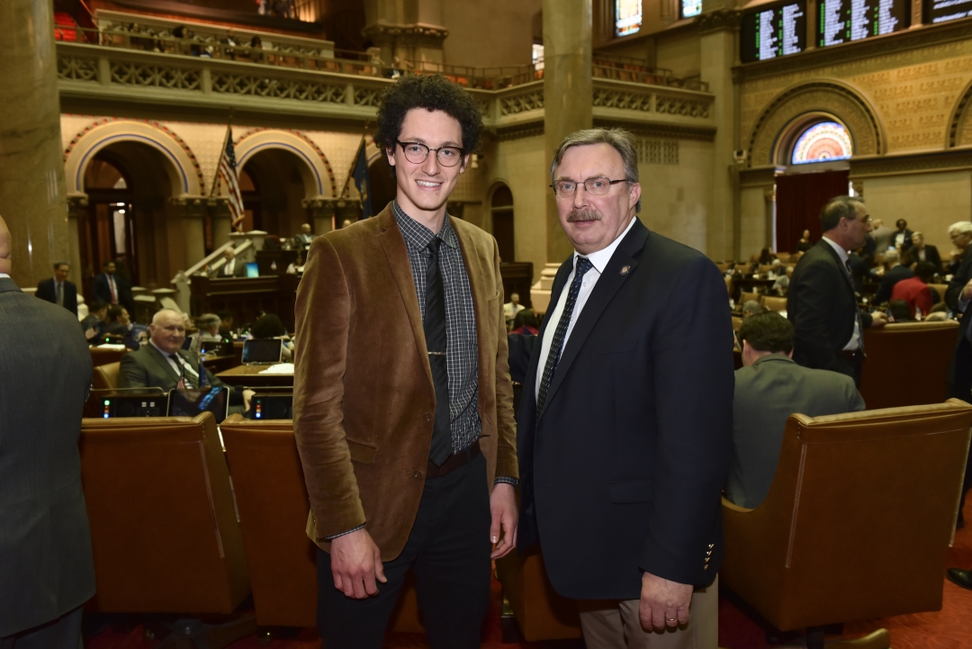Pictured above Assemblyman Brian Miller (left) poses with his 2019 Legislative Intern, Michael Howard, from Clinton, New York in the State Assembly Chamber in Albany on May 8, 2019.