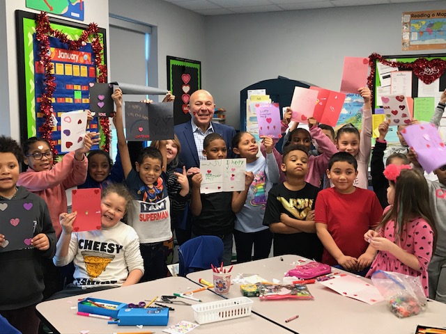 Assemblyman Angelo Morinello (R,C,I,Ref-Niagara Falls) and 3rd grade students from Niagara Street Elementary School in Niagara Falls show off their valentine cards.