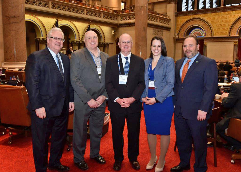 In the attached photo in the state Assembly Chamber, from left to right: Senator O’Mara, Corning City Manager Mark Ryckman, Corning Mayor Bill Boland, Corning City Councilmember Alison Hunt, and Assemblyman Palmesano.
